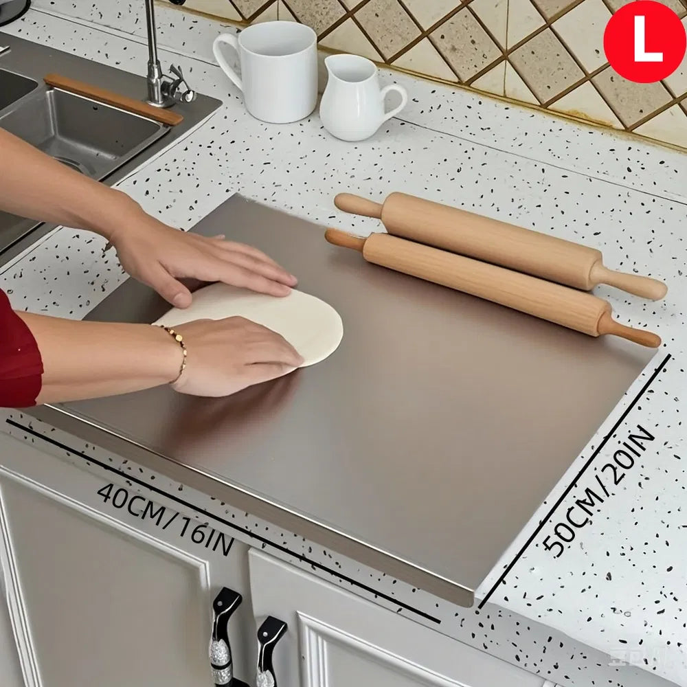Stainless steel countertop cutting board with raised lip