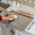 Stainless steel countertop cutting board with raised lip