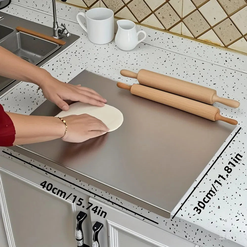 Stainless steel countertop cutting board with raised lip